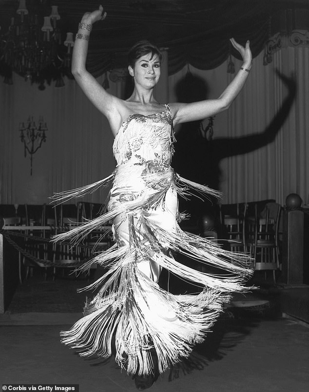 Tall, slim and beautiful, April became a supermodel. Pictured is her performing a singing and dancing act at the Astor Club in London's West End in 1962.