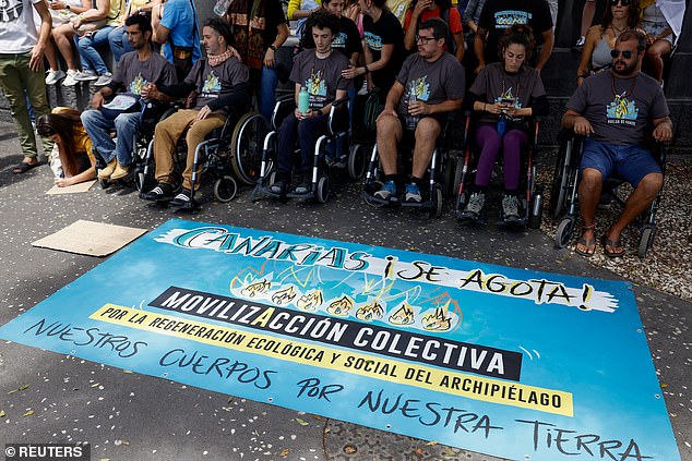 Hunger strikers sit in wheelchairs during a protest for a change in the tourism model in the Canary Islands, in Santa Cruz de Tenerife, Spain, last month.