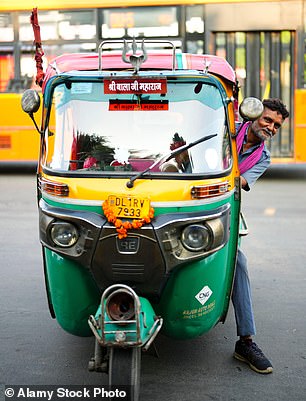 Above, a tuk-tuk driver