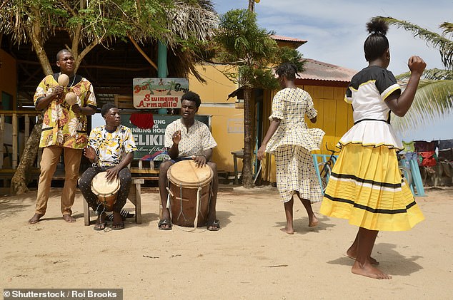 Above, locals perform a traditional Garifuna performance in the village of Hopkins.