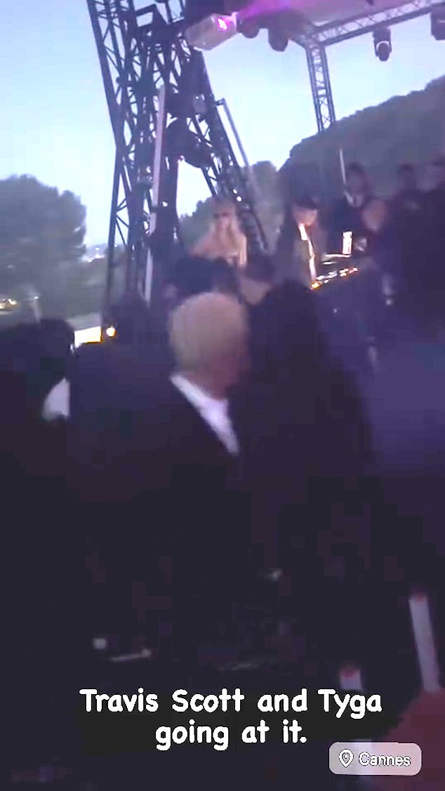 Travis reportedly took the microphone away from Akiva, prompting Edwards (pictured in front), who was making friends with Tyga earlier in the night, to say something to him.