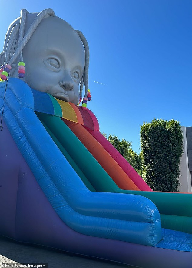 The party also featured a giant inflatable rainbow slide from Astroworld for the kids to enjoy.