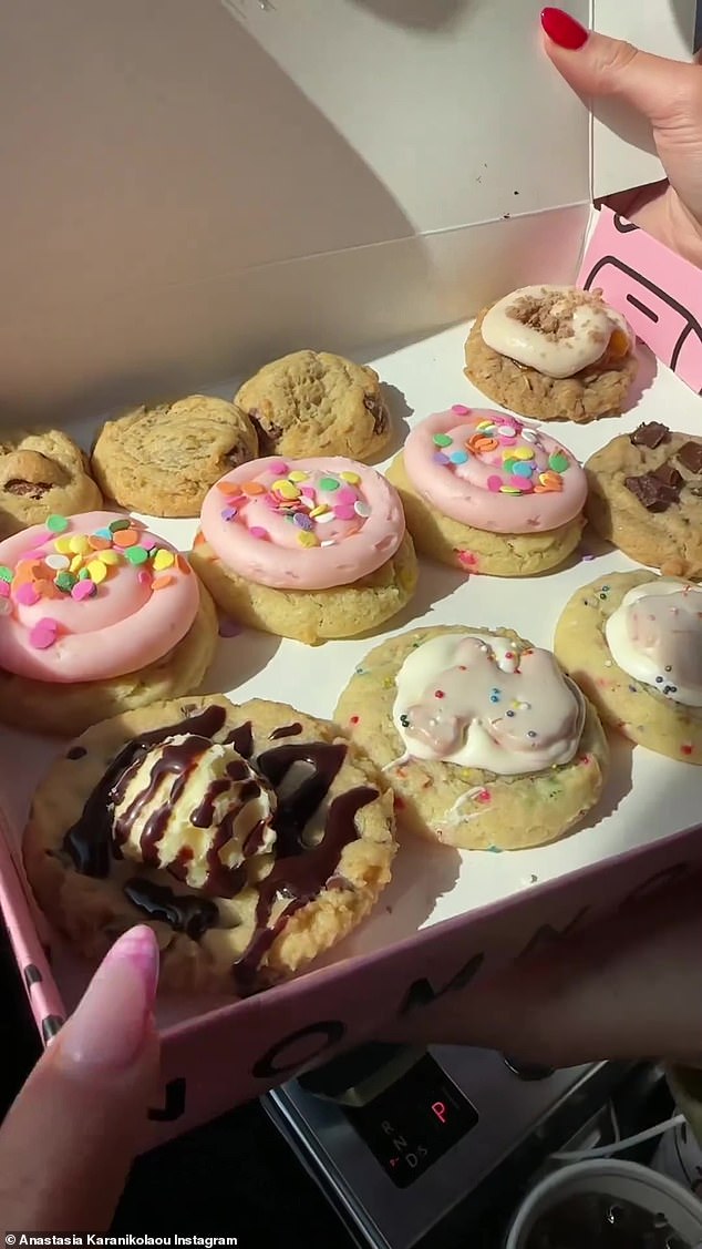 The ladies show off their fun selection of cookies.