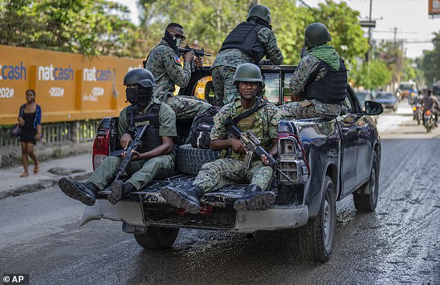 Members of the Haitian armed forces patrol the streets of Port-au-Prince