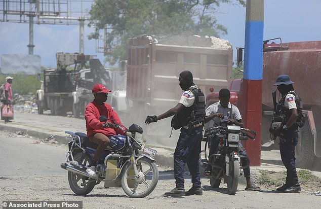 Police control motorcyclists near Port-au-Prince airport