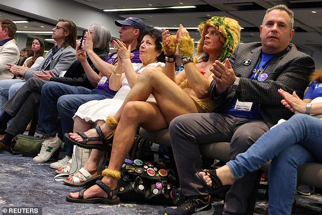 Attendees at the Libertarian National Convention, to be held at the Washington Hilton in Washington, DC, applaud during Robert F. Kennedy Jr.'s speech on Friday afternoon. They will choose their own candidate, but they will invite other presidential candidates to speak