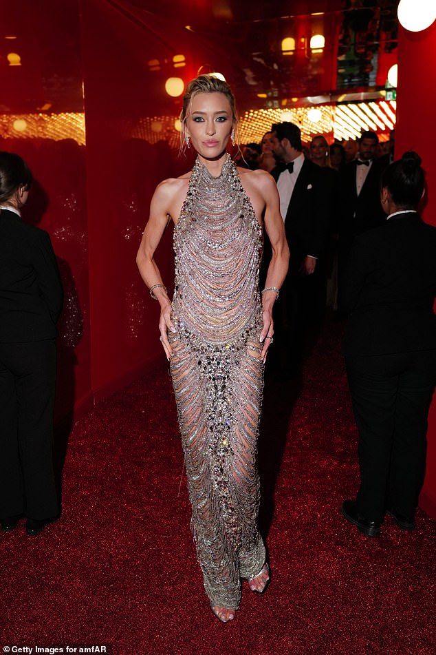 Renee, from Nashville, Tennessee, cut a glamorous figure in an extravagant bejeweled silver dress that showed off her incredible figure as she posed for the cameras.