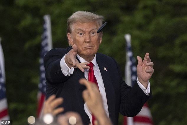 Former President Donald Trump tosses a pen during his Thursday night rally in the Bronx. During an interview after the rally, he declined to name his top three picks for vice president, which reportedly now includes Cotton.