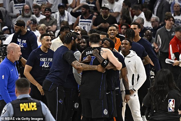 After the whistle, Doncic flexed before the stunned crowd as his teammates surrounded him.