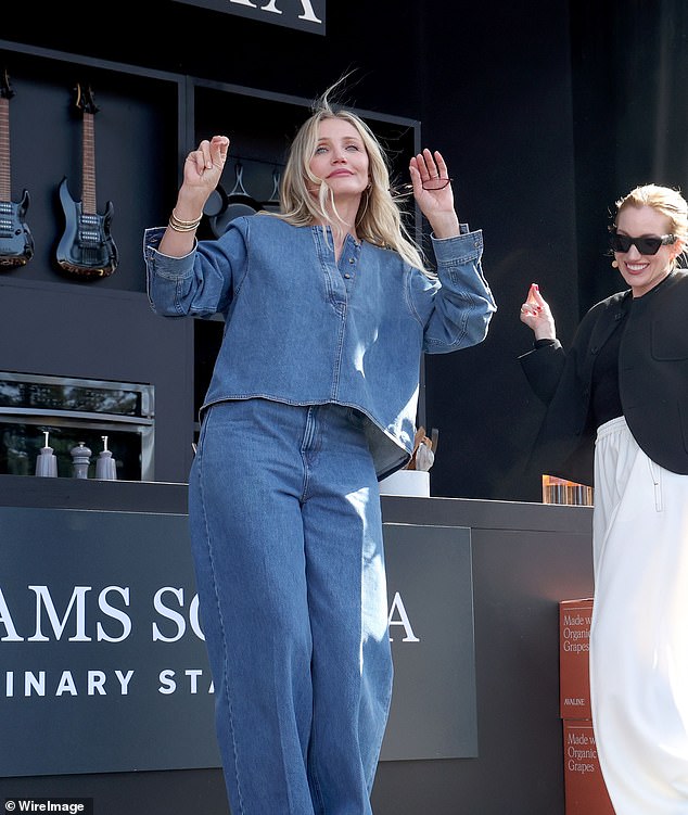 The businesswoman wore a black blazer and a tight-fitting top, a pair of flowy white pants that added contrast to the look.