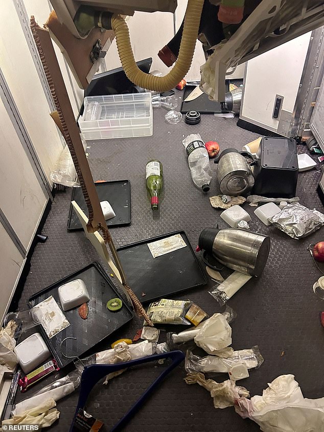 Authorities said the turbulence was believed to have occurred while meals were being served and many people were not wearing seat belts. Pictured: Food scattered around the plane.