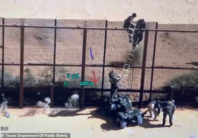 Border Patrol agent struggles to remove ladder from smugglers