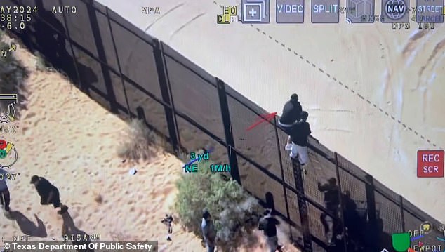 Smugglers perched atop the border wall threw water bottles at agents below.