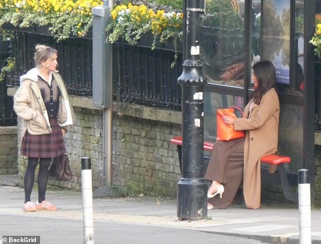 Renee was seen wandering around town in a tartan skirt and vintage blue and gray cardigan, paired with a white quilted coat.