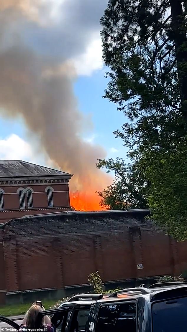 Broadmoor Hospital in Crownthorne is currently engulfed in flames that are sending plumes of black smoke into the sky.