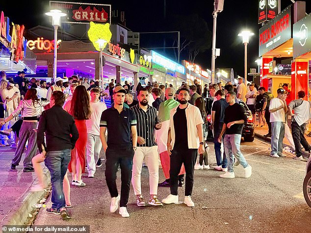 Tourists gather on the Strip in Magaluf, Mallorca, for a drunken night