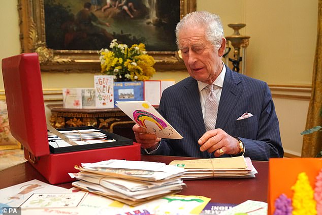 Charles III at Buckingham Palace reading cards and messages sent by well-wishers following his cancer diagnosis