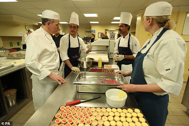 Buckingham Palace Head Chef Mark Flanagan (left) alongside other members of the kitchen staff as they prepare for a reception to mark the launch of the UK-India Year of Culture, 2017.