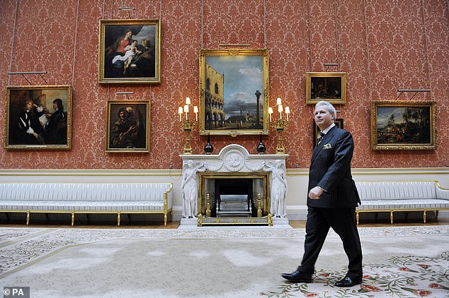 Edward Griffiths, then deputy head of the household, walks through the picture gallery at Buckingham Palace, 2011