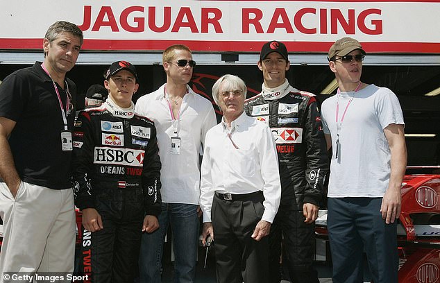 Formula One supreme Bernie Ecclestone with Hollywood stars in the Jaguar pit lane