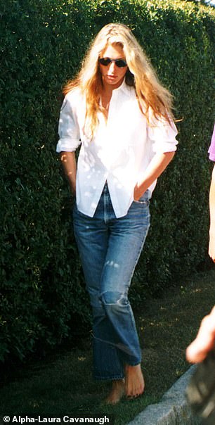 Carolyn dressed up for Labor Day in 1996 in a similar oversized shirt with rolled up sleeves, ripped jeans, messy hair, and sunglasses.