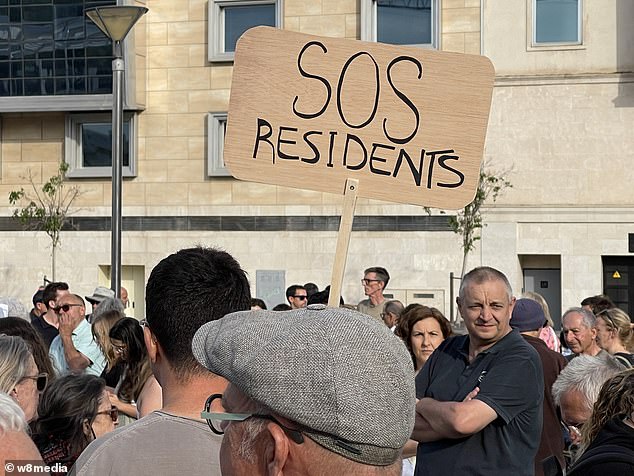 Protesters carrying banners with anti-tourism slogans and playing drums gathered in the capital, Palma de Mallorca.