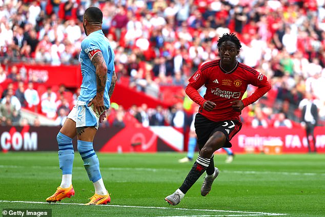 Mainoo walks away after scoring the winner for Man United in Saturday's FA Cup final