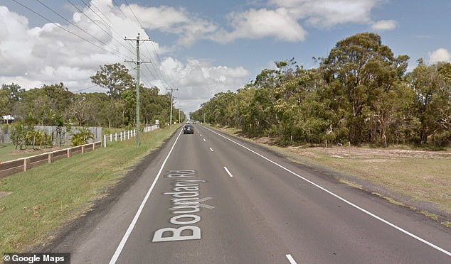 Queensland Police said the woman, aged in her 40s, was walking along Boundry Road (pictured) when she was struck and killed by a silver Ford Falcon.