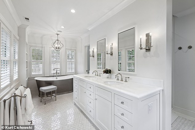 Pictured: The master suite's spa bathroom with tile floors is elegant and luxurious.