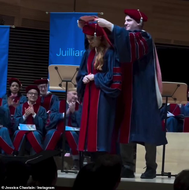 The star was later filmed being led to the front of the stage and given a special sash to hang around her neck.