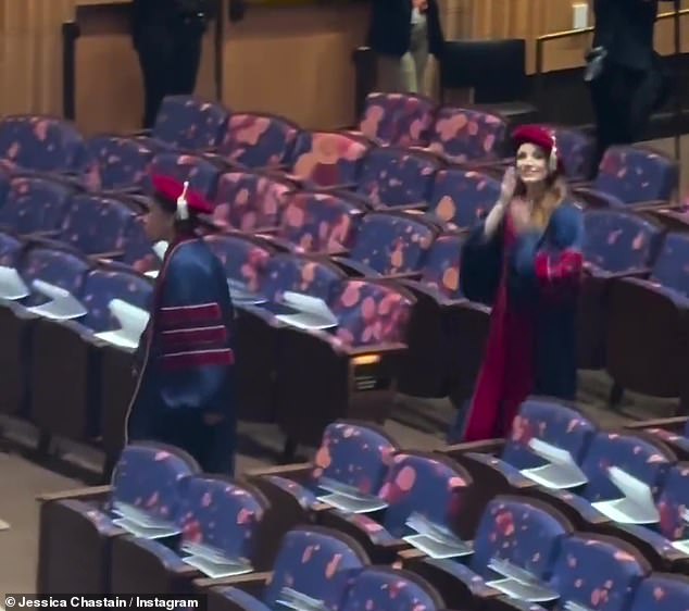 Jessica found her seat inside an auditorium and later, other graduates in black robes and caps could be seen gathering for the big day.