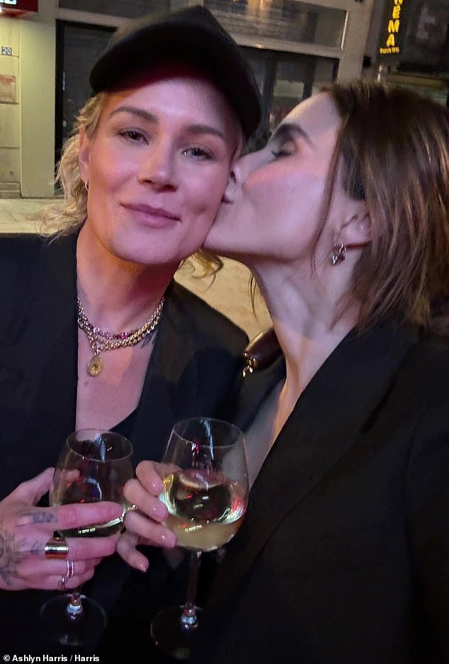 Ashlyn turned on her own Insta Stories and posted a selfie in which Sophia gave her a kiss on the cheek while they toasted white wine.