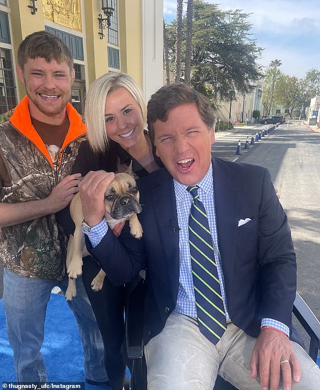 Mitchell and his wife photographed with former Fox News host Tucker Carlson