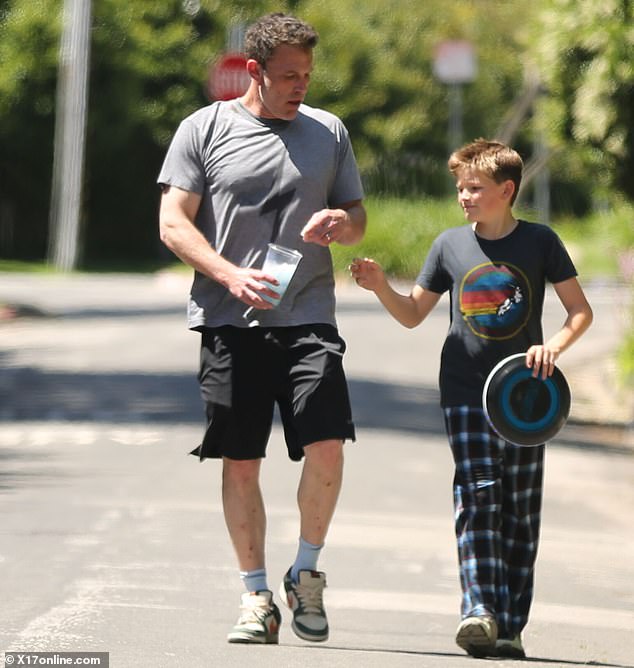 Affleck completed the look with a pair of old-school white Nike sneakers with green and orange accents.