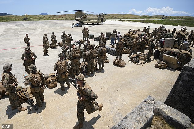 U.S. and Philippine Marines wait at the airport in Itbayat City, in the far northern Philippines, Batanes province, during a joint military exercise Monday, May 6, 2024.