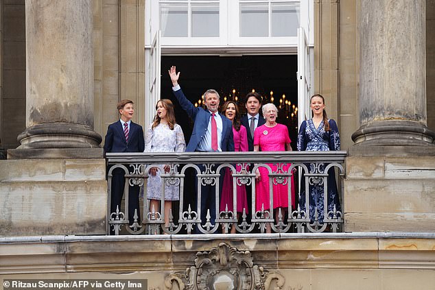 Pictured: King Frederick greets a crowd of royal admirers in Copenhagen who wished him a happy 56th birthday.