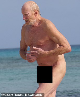 Charles showed off his toned physique as he strolled along the sands of the nudist beach before taking a refreshing dip in the ocean.