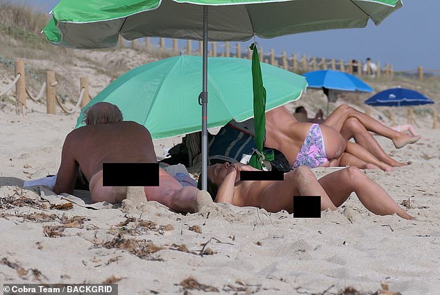 The couple who met on the set of their 2020 film, The Book of Vision, sheltered from the scorching sun under an umbrella