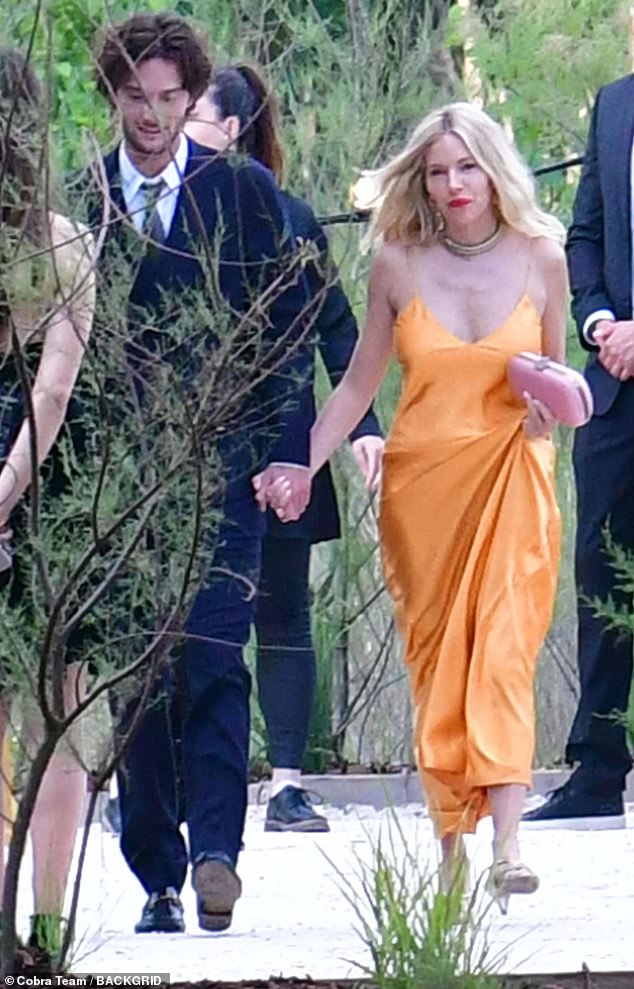 Sienna and Oli were seen after the ceremony walking hand in hand together in the sunshine.