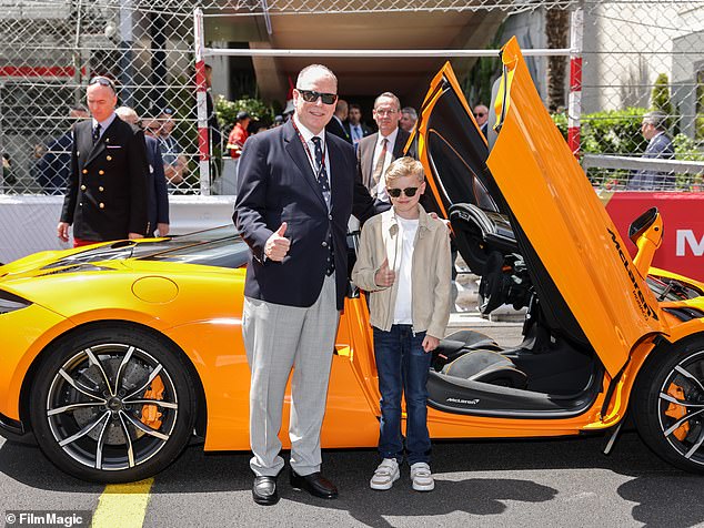 Prince Albert poses with his son, Prince Jacques, at the Monaco Grand Prix in Monte Carlo this afternoon.