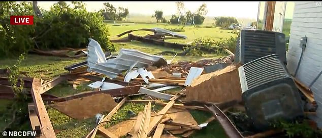 A home in Valley View appears surrounded by debris Sunday after a tornado.