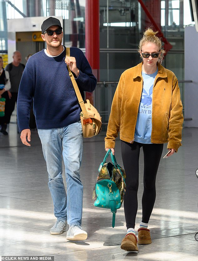 The couple seemed in good spirits as they made their way through the airport before heading out on a romantic getaway.