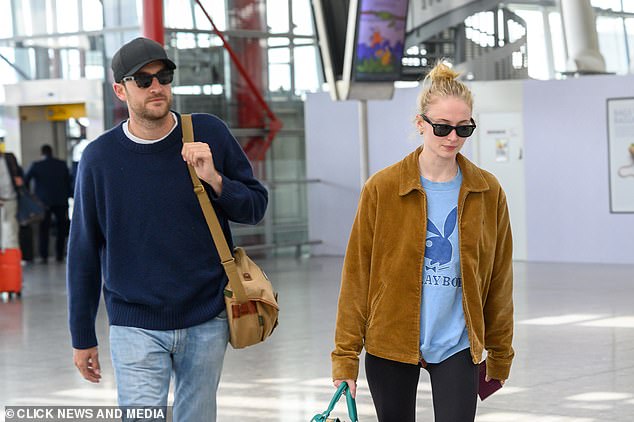 Sophie and Peregrine walked through the airport.