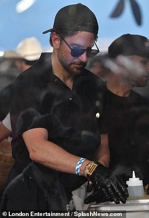 At the festival, Cooper dressed like a chef in an all-black outfit and an apron.