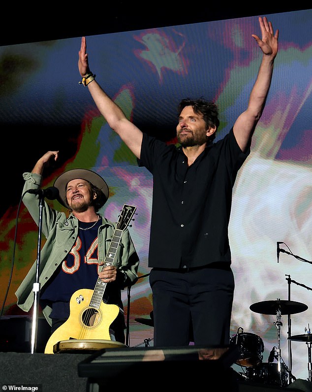 Cooper later took off his apron and sunglasses as he joined Pearl Jam's Eddie Vedder on stage.