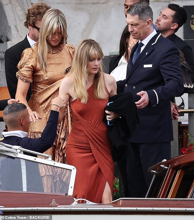 Cressida looked focused as she boarded the water taxi to arrive at the celebrity-studded wedding ceremony.