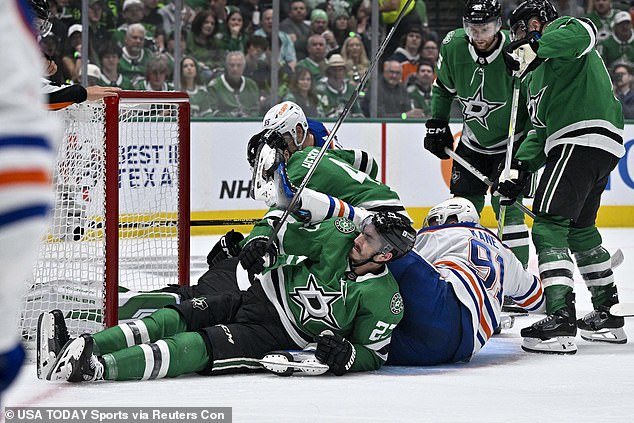 Dallas Stars left wing Mason Marchment (27) and defenseman Miro Heiskanen (4) and Edmonton Oilers left wing Evander Kane (91) and left wing Dylan Holloway (55) collide