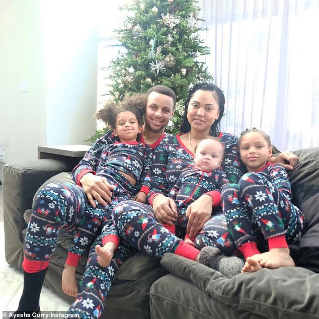 PICTURED: Stephen, Ayesha, Riley (far right), Ryan (far left), and Canon Curry (on Ayesha's lap)