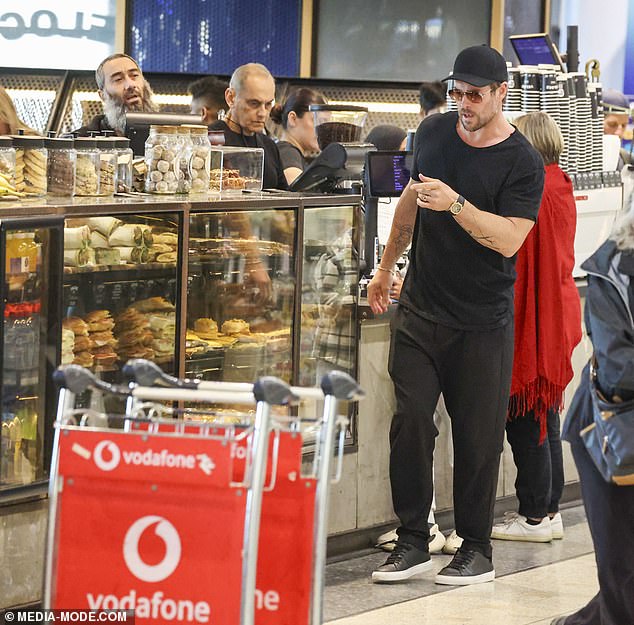 At one point, Chris decided to treat his kids to a post-flight snack by taking them to a food kiosk inside the arrivals terminal.