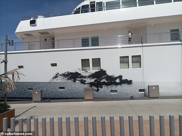 Protesters sprayed black paint on the superyacht